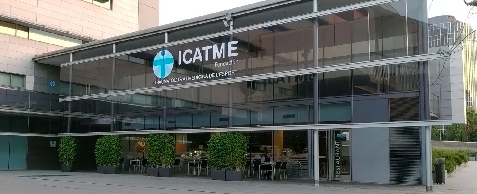 Glass facade and signage of the ICATME centre
